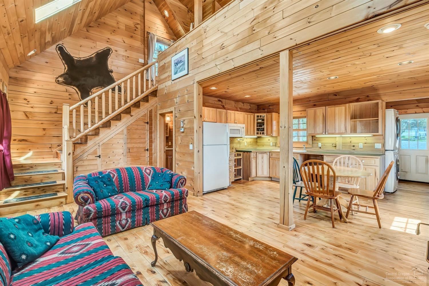 2001 Northwest McDaniel Road Powell Butte, OR 97753 - Photo 19 of 24 Cabin living area and kitchen