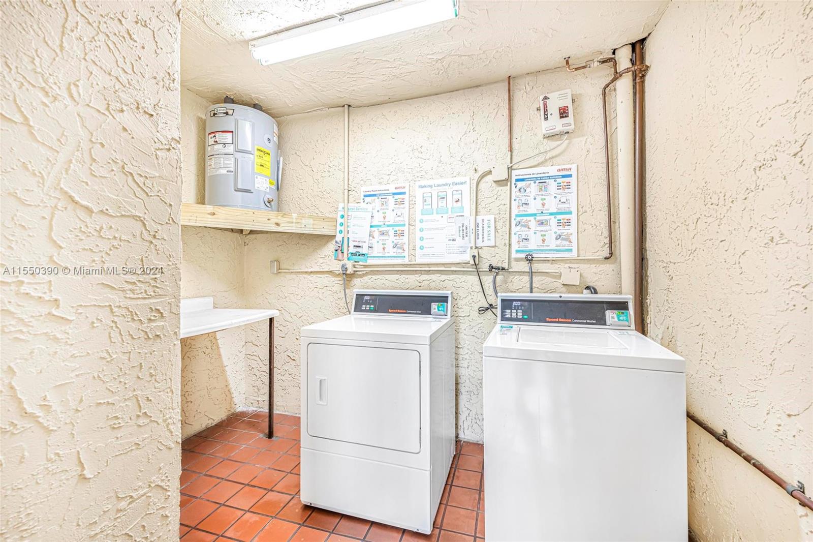 9107 Southwest 137th Terrace, Unit 14 Miami, FL 33186 - Photo 22 of 25 a utility room with dryer and washer