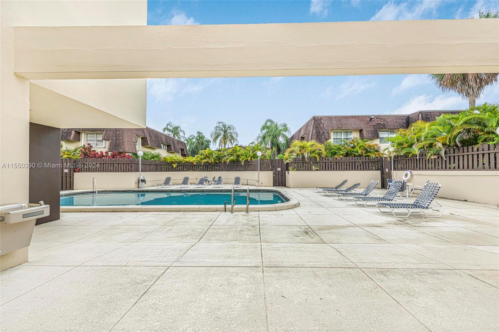 9107 Southwest 137th Terrace, Unit 14 Miami, FL 33186 - Photo 23 of 25 a view of swimming pool