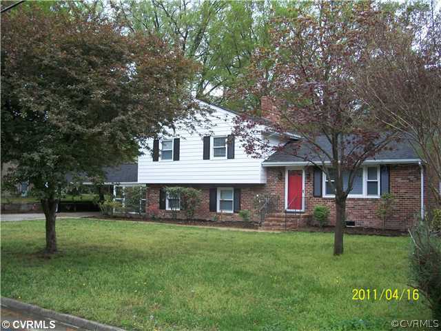 1211 Covington Road Colonial Heights, VA 23834 - Photo 1 of 11 a front view of house with yard and green space