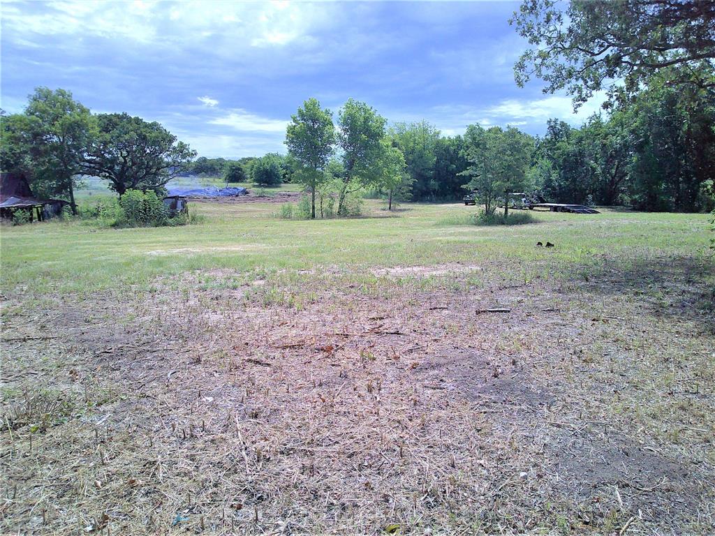5 Border Street Montague, TX 76251 - Photo 3 of 7 a view of outdoor space with green field and trees