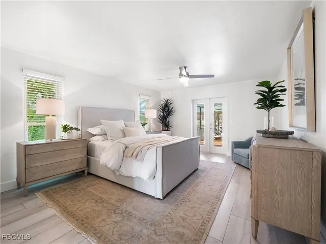 a bedroom with a bed and a potted plant