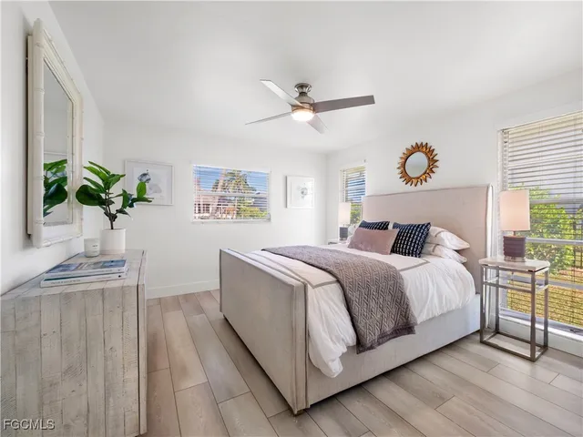 a bathroom with a double vanity sink a mirror and a bathtub