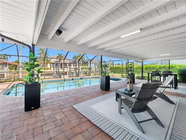 a outdoor dining space with furniture and outdoor view