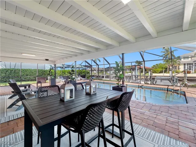a view of a swimming pool with a patio