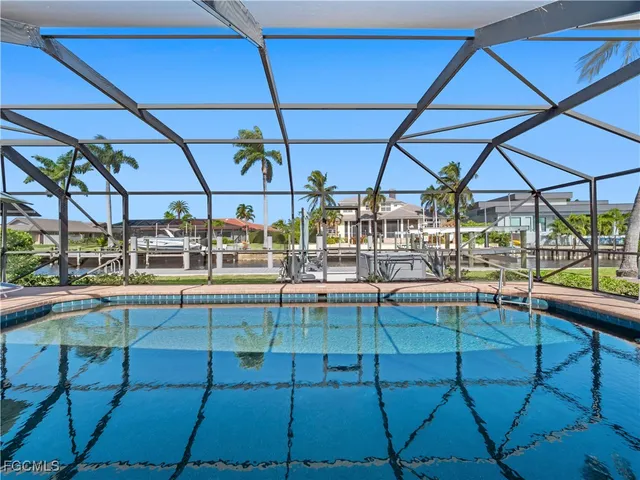 a view of a swimming pool with a patio