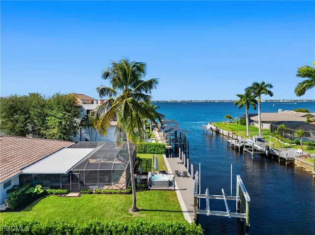 a view of a swimming pool with lounge chairs