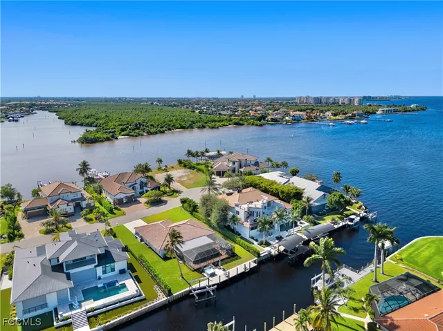 an aerial view of a house with a lake view