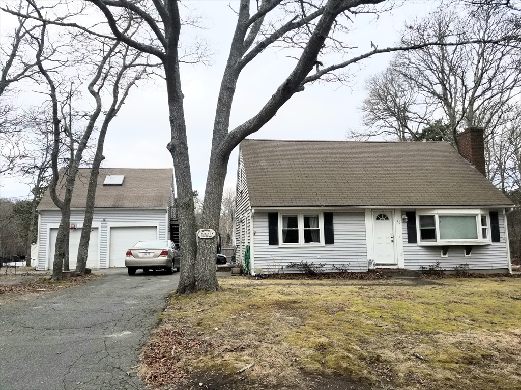 30 Princess Pine Road Hyannis, MA 02601 - Photo 1 of 10 a house that has a tree in front of it