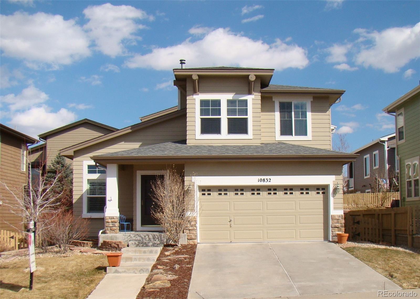 10832 Towerbridge Road Highlands Ranch, CO 80130 - Photo 1 of 31 a front view of a building with parking space