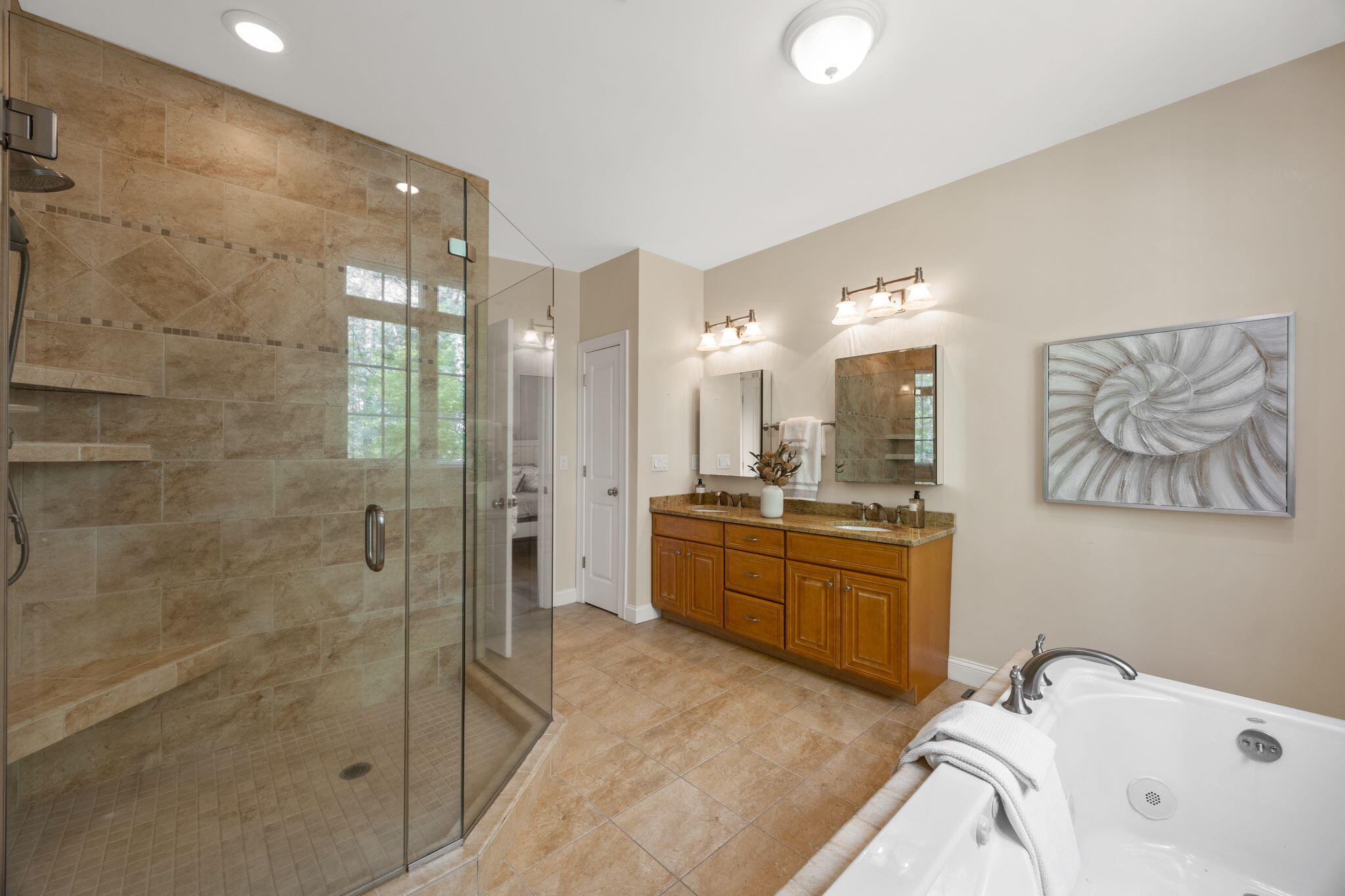 17 Payamps Road Mashpee, MA 02649 - Photo 44 of 72 a large bathroom with a tub sink shower and mirror