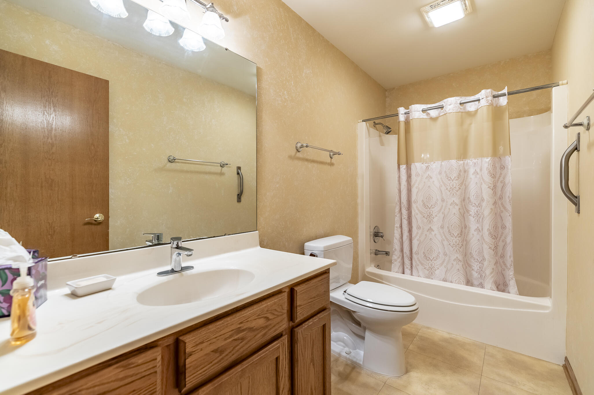 9841 Hart Street St. John, IN 46373 - Photo 17 of 28 a bathroom with a sink toilet and shower