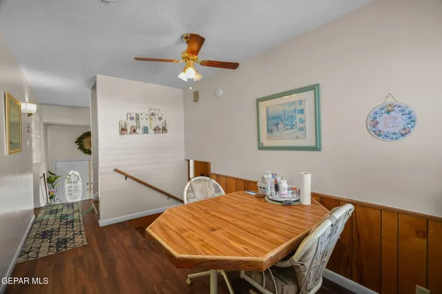 a view of a livingroom with workspace and a couch