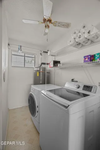 a living room filled with furniture and a chandelier