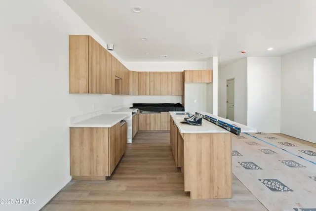 a kitchen with a stove and a refrigerator