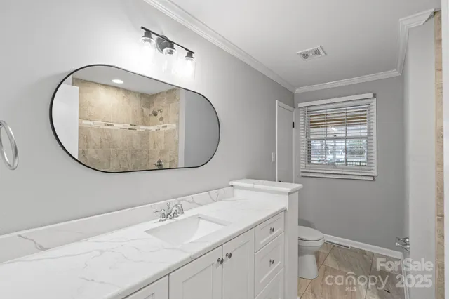 a front view of a house with yard and seating space