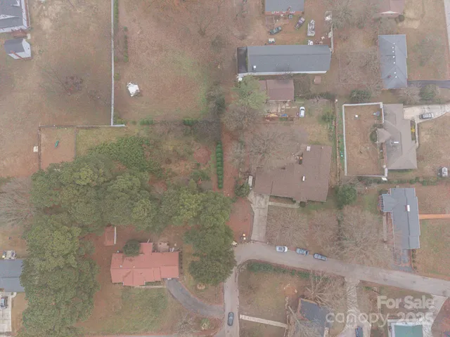 a view of a terrace with chairs and a book shelf
