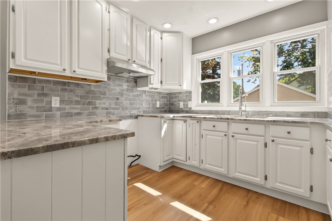 67 Harwick Road Irondequoit, NY 14609 - Photo 13 of 33 Updated kitchen featuring freshly painted cabinets w/ updated pulls