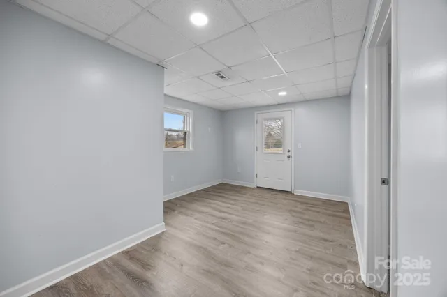 a bathroom with a sink a toilet and window