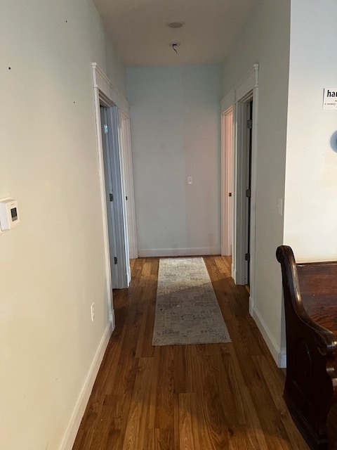 466 County Road 100 North Sadorus, IL 61872 - Photo 17 of 29 a view of a hallway with wooden floor and furniture