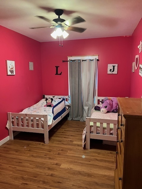 466 County Road 100 North Sadorus, IL 61872 - Photo 19 of 29 a bedroom with a bed and a chandelier