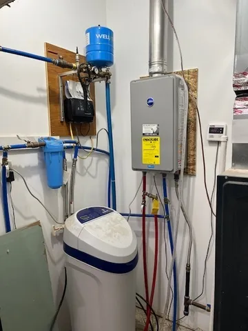 a bathroom with a sink toilet and mirror