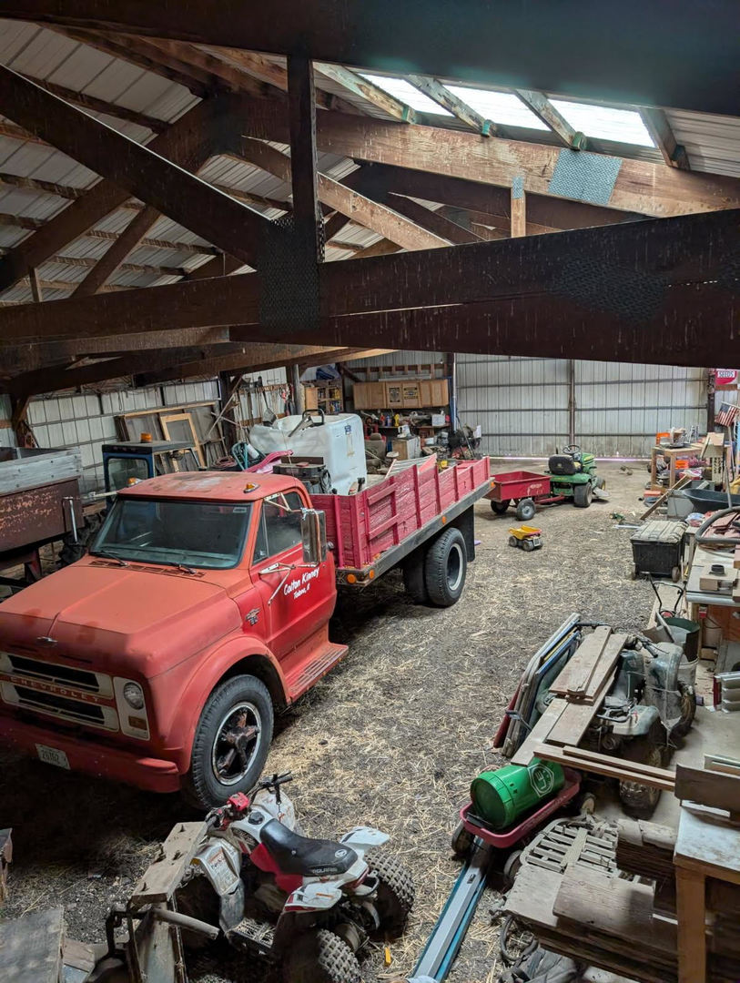 466 County Road 100 North Sadorus, IL 61872 - Photo 29 of 29 a car is parked in a garage