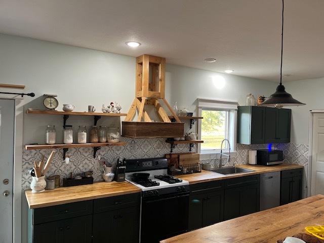 466 County Road 100 North Sadorus, IL 61872 - Photo 8 of 29 a kitchen with granite countertop a sink stainless steel appliances and cabinets