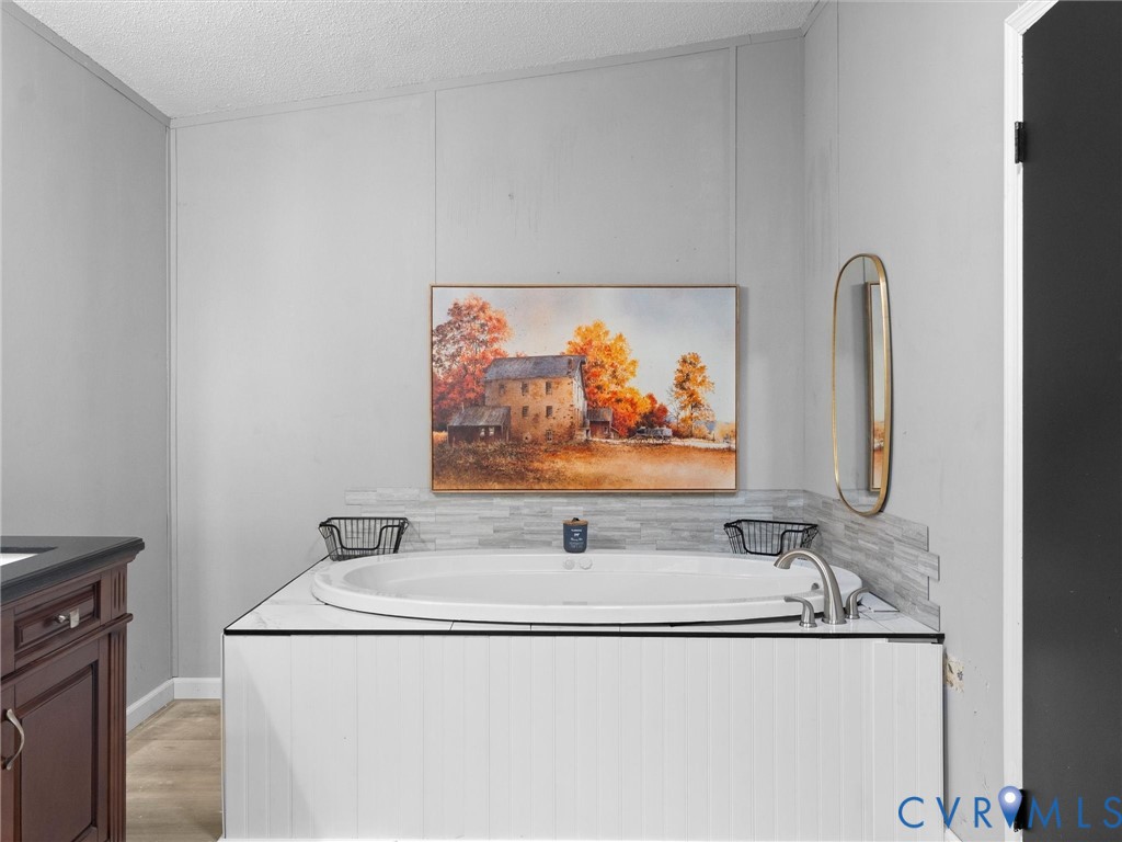 1909 Neves Road Beaverdam, VA 23015 - Photo 31 of 48 Built-in soaking tub with a tiled surround, brushe
