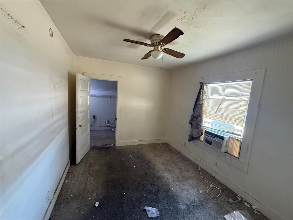 1724 McFerrin Avenue Waco, TX 76708 - Photo 7 of 11 wooden floor in an empty room with a window