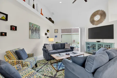 a bathroom with a tub shower vanity and a sink