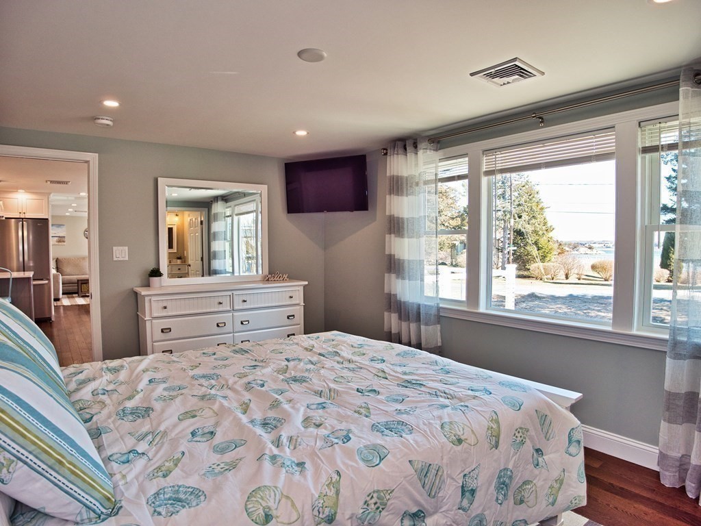 3 East Shore Road Westport, MA 02791 - Photo 13 of 21 a bedroom with a large bed and a large window