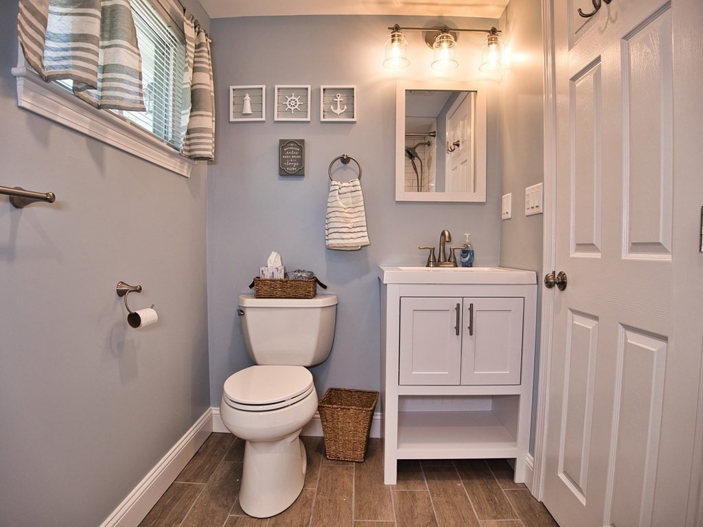 3 East Shore Road Westport, MA 02791 - Photo 19 of 21 a bathroom with a toilet sink and mirror