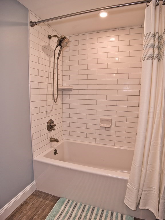 3 East Shore Road Westport, MA 02791 - Photo 20 of 21 a bathroom with a bathtub and shower