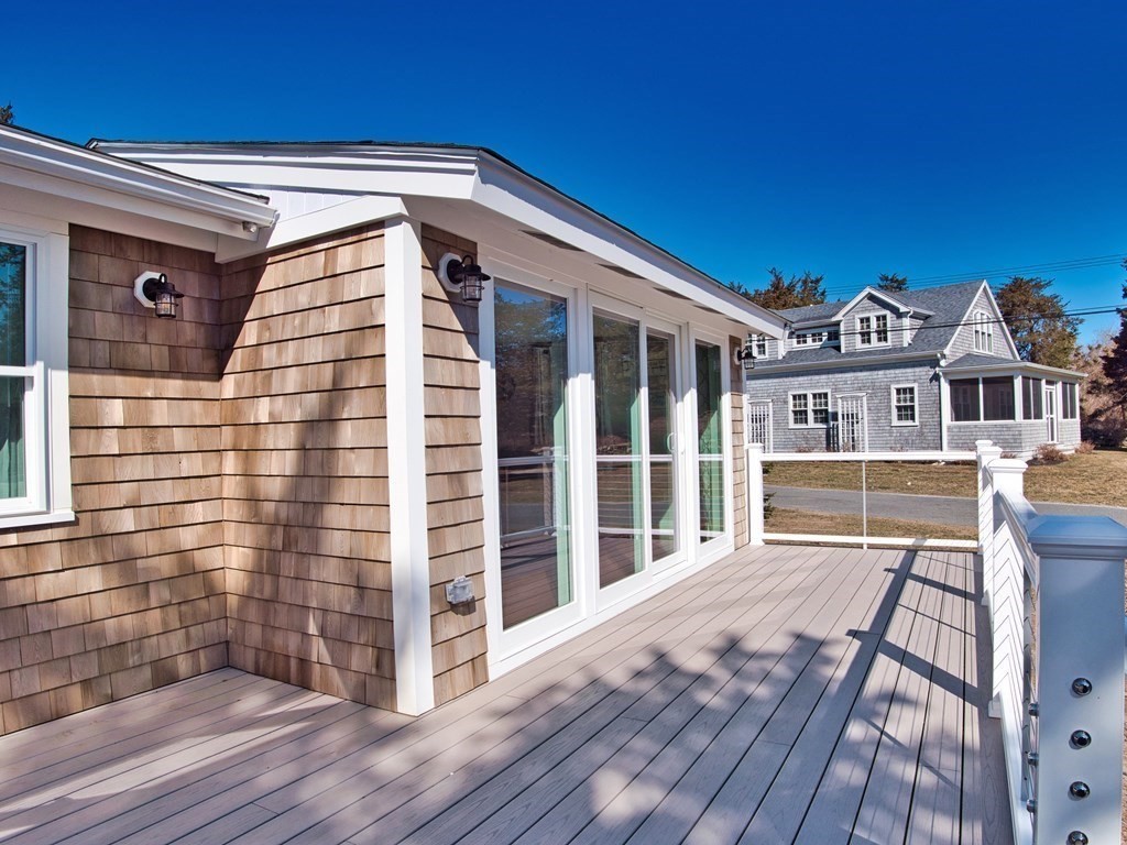 3 East Shore Road Westport, MA 02791 - Photo 6 of 21 a view of a house with a wooden deck