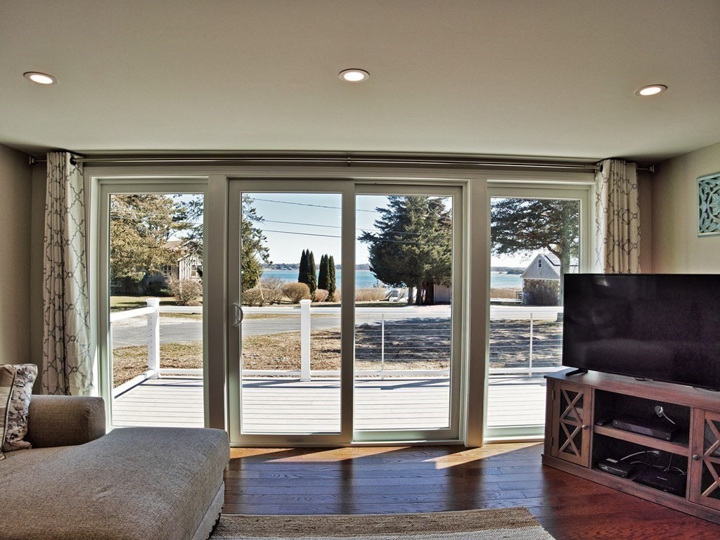 3 East Shore Road Westport, MA 02791 - Photo 8 of 21 a living room with furniture and a flat screen tv