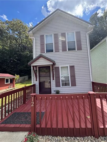 a front view of a house with balcony