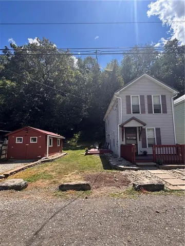 a house view with a outdoor space