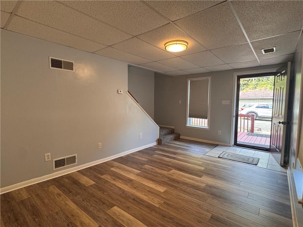 12 Young Lane Charleroi, PA 15022 - Photo 4 of 24 a view of an empty room with wooden floor and a window