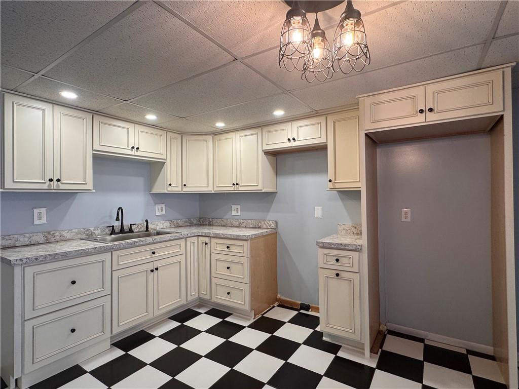 12 Young Lane Charleroi, PA 15022 - Photo 6 of 24 a kitchen with a sink a refrigerator and cabinets