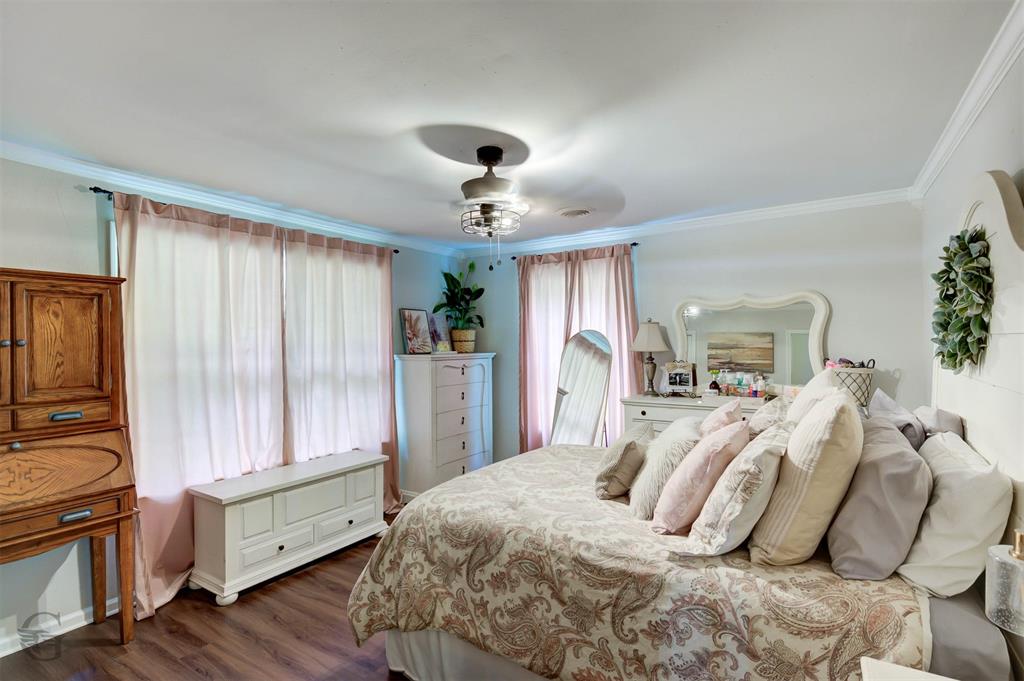 701 Chandler Road Haughton, LA 71037 - Photo 18 of 25 a bedroom with a bed and a chandelier