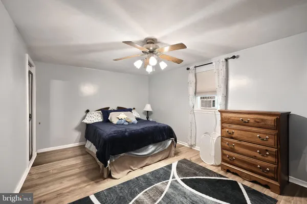 a bedroom with a bed and a television