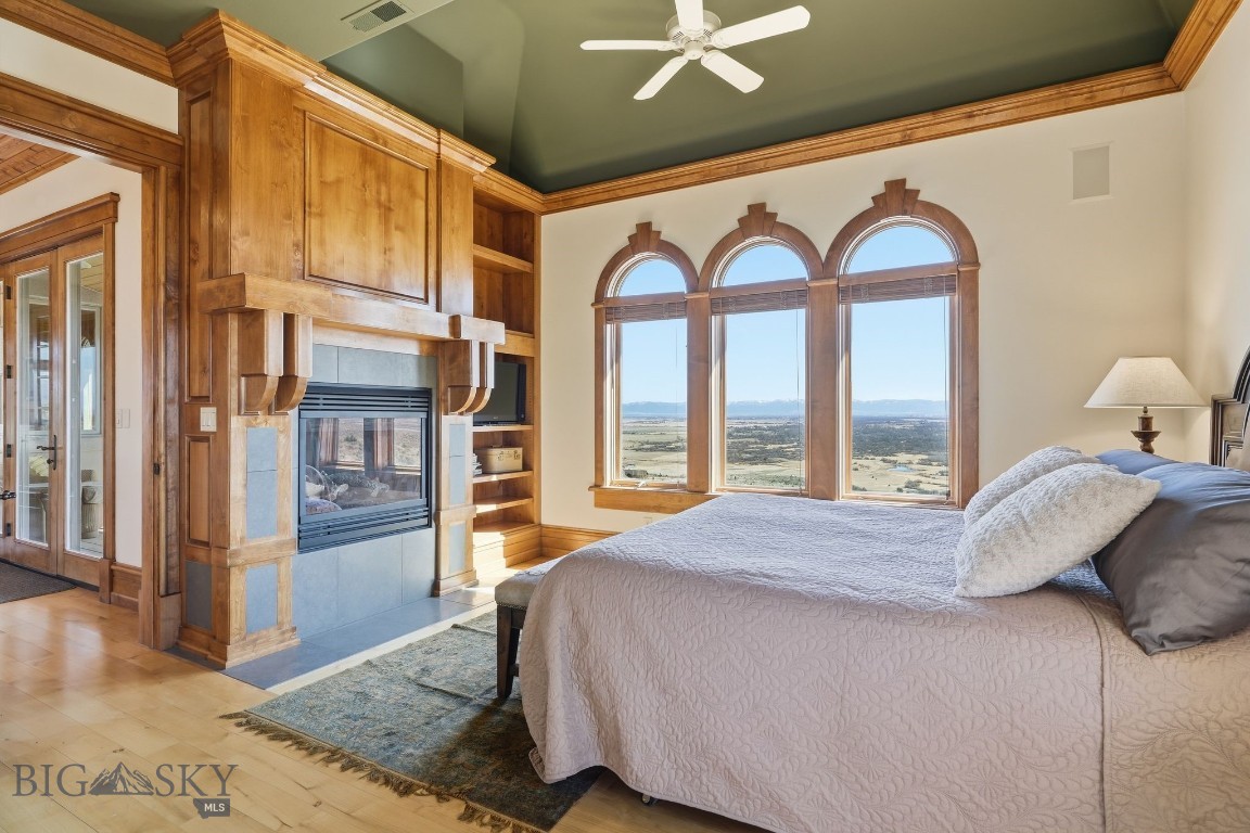 1240 Twin River Cutoff Road Manhattan, MT 59741 - Photo 27 of 88 Serene primary bedroom with fireplace