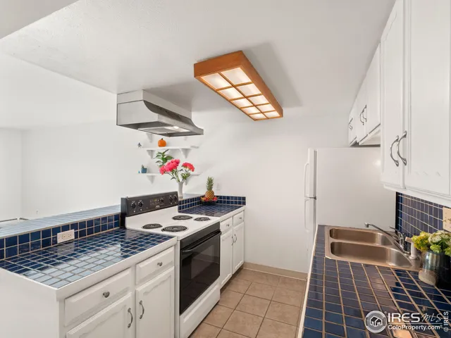 a kitchen with stainless steel appliances granite countertop a stove and a sink