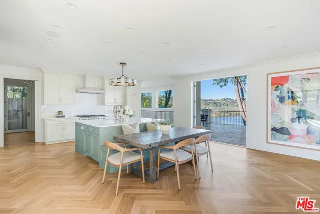 a room with a counter space a sink and appliances