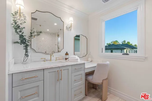 a bedroom with a large bed a rug and a window