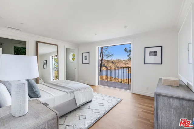 a view of a balcony with wooden fence and floor