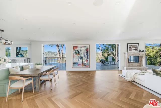 a dining room with furniture and a fireplace