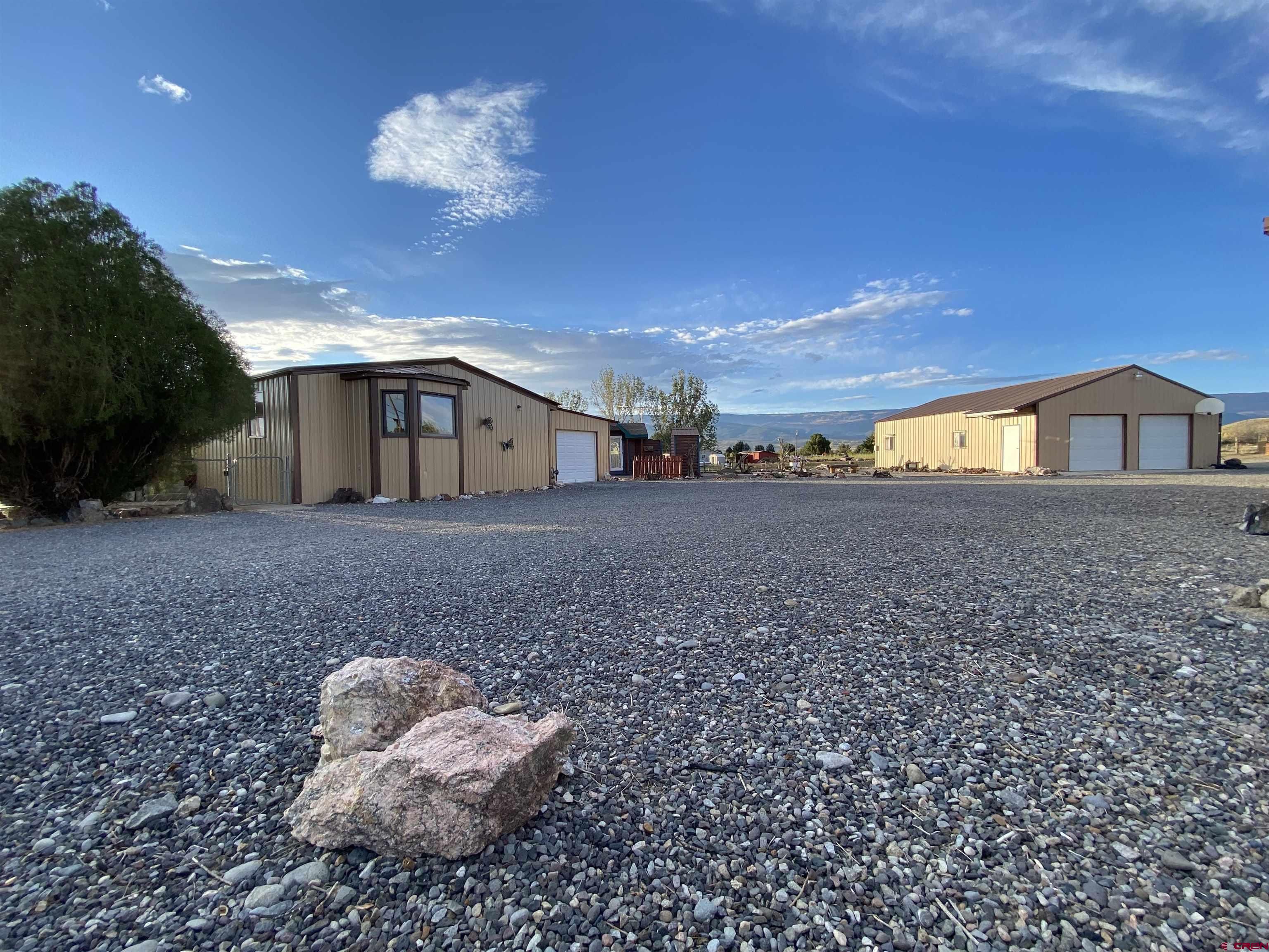 21159 Nowhere Road Eckert, CO 81418 - Photo 1 of 27 a view of a house with a yard