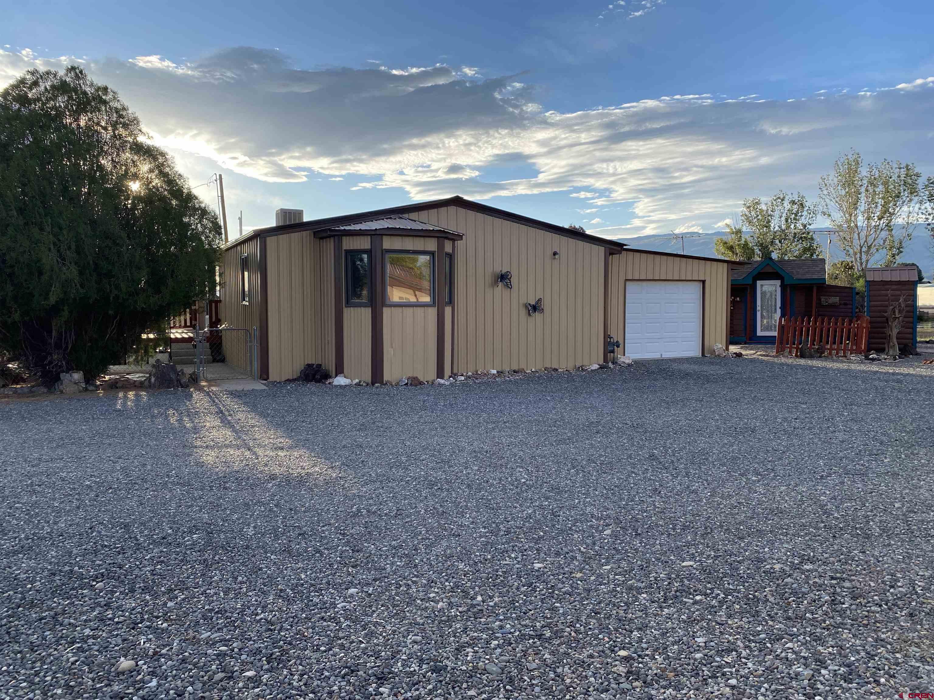 21159 Nowhere Road Eckert, CO 81418 - Photo 2 of 27 a view of a house with backyard